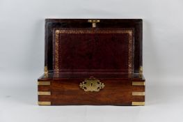 An excellent rosewood brass cornered writing slope with brass plaque and escutcheon, the top opening