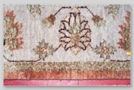 A G H Frith Limited 20th Century 100% wool pile hand knitted Indian carpet with floral pattern on