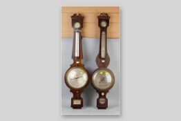 A late 19th Century rosewood banjo barometer with thermometer and twin swan neck pediment, the