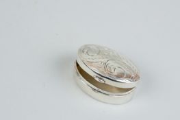 A pill box - an oval bright cut silver pill box, 0.2 ozs, London 1987