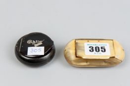 An oblong bone snuff box and a 19th Century circular horn snuff box with inlaid silver flower to the
