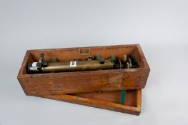A brass compass theodolite in original mahogany box (top phial broken, hinges need replacing to