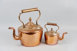 A Georgian copper kettle along with a small example of similar age and style