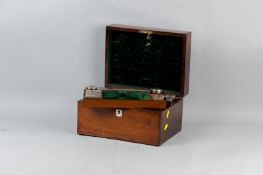 A Victorian rosewood fitted lady's travel case, the lid opening to reveal a velvet lined back,