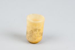An ox bone cup with Oriental figural scene