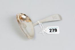A caddy spoon - a silver caddy spoon with large tapered oval bowl with coin base and a shaped and