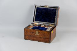 A Victorian rosewood travelling toiletry box with inset brass plaques and escutcheon, the velvet