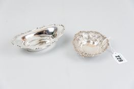 Two silver dishes - an oval plain dish with shaped border, 1.7 ozs, Sheffield 1946 and a heart