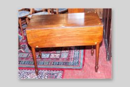 A late Victorian mahogany twin leaf Pembroke table with single drawer and opposing dummy drawer