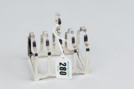 A toast rack - a four section silver toast rack, 2 ozs, Sheffield 1936