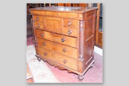 A Victorian oak Scottish chest of drawers, central hat drawer flanked by two smaller drawers