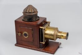 A Victorian mahogany and brass Magic Lantern (later converted for electricity) of traditional design