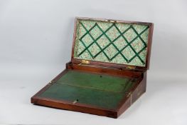 A 19th Century mahogany and brass bound campaign writing slope, double hinged lid and slope with