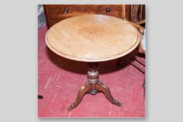 A Georgian mahogany tilt top tripod table with chamfered edge on a carved bulbous support with three