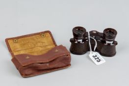 A pair of bakelite British opera glasses in a case by Kershaw
