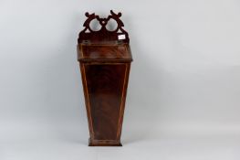 A Victorian mahogany and boxwood line inlaid candle box of tapering form, the hinged slope lid