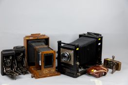 A large Kodak model B 6.5 x 4.75 view camera, a mahogany cased Express Daylight englarger, a no. 6