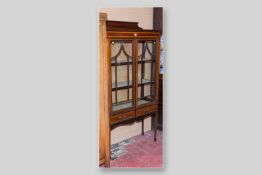 An Edwardian mahogany and crossbanded string inlaid two door china display cabinet, six pane twin