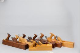 Seven woodworker's jack planes including a side rebate, a cut down handle 16 ins chamfer, some if