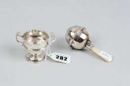 A teething rattle - a baby's mother of pearl handled silver teething rattle, Birmingham 1919 and a