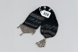 A Victorian woven beadwork sovereign purse dated 1894