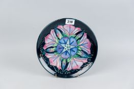A Moorcroft pottery limited edition (409/500) year plate for 1996, decorated in the 'Morning