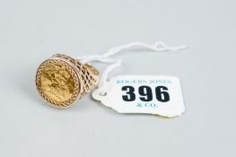 A 1982 half sovereign ring with nine carat gold basket mount, 10.2 grms