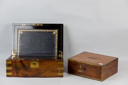 A Victorian brass mounted walnut writing slope with ebonized interior and gilt tooled leather