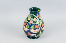 A Moorcroft pottery ovoid vase decorated in the 'Strawberry Thief' pattern, underglaze impressed and