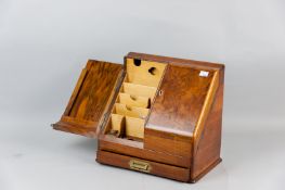 An excellent Victorian burr walnut stationery box, the twin slope fronted doors opening to reveal
