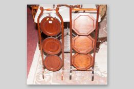 A Victorian mahogany folding cakestand with three circular trays and an Edwardian mahogany folding