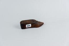 A 19th Century carved treen snuff box in the form of a shoe with slide-off lid