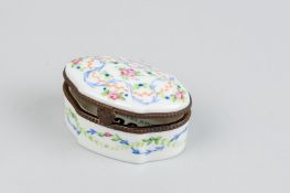 A shaped oval hand painted Limoges porcelain lidded box