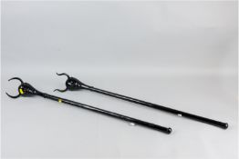 Two unusual japanned metal canes with horned head tops, 32 ins (81.5 cms)