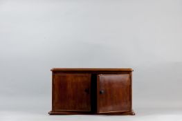 A mahogany two door table cabinet with moulded edge top and base, 10 x 18 ins (25.5 x 46 cms)