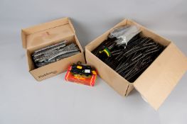 A Triang 0-6-0 tank locomotive and two boxes of track with electric and manual points with switches