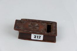 A small 18th Century oblong carved box in the form of a book with sliding top lid