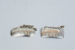 Two decanter labels - a silver decanter label 'Whiskey' with chain, 0.2 ozs, London 1812 and a