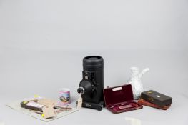 A cased Kodak Retina projector, a pottery improved earthenware inhaler, a pink lustre mug with a
