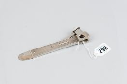 A cigar cutter - an engine turned silver cigar cutter, 3.3 ozs gross, Birmingham 1956 with a cutting