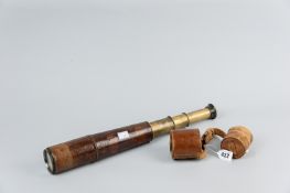 A leather bound brass three draw telescope stamped 'R & J Beck Ltd, London, 1917', tan leather outer