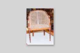 An ash and Bergere cane seated child's armchair on turned and twist decorated front supports, 25.