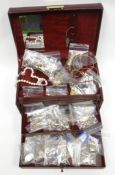 A modern red jewellery box containing a large quantity of modern, mainly 9ct yellow gold fine