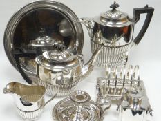 A parcel of EPNS including a three-piece tea-service of fluted form, a toast-rack, chamber-stick