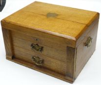 An extensive and complete oak canteen of Walker & Hall cutlery, the canteen with two drawers below