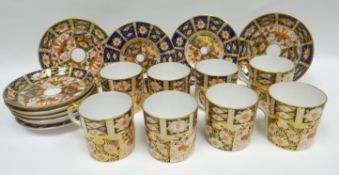 Eight Royal Crown Derby Imari coffee-cans and saucers