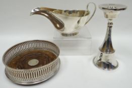 An Elizabeth II pierce-work silver and wooden wine-coaster, London 1985; together with a single