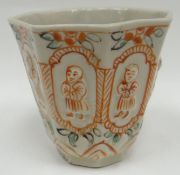 An unusual early eighteenth century Fukien porcelain octagonal wine-cup, each of the eight facets