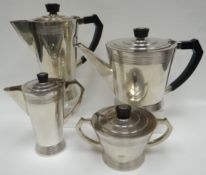 A four-piece British-made Art Deco tea-service with black bakelite handles marked 'Century Plate' to