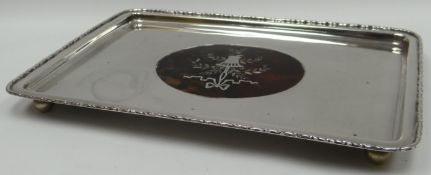 A silver galleried tray with oval tortoise shell centre insert being silver and mother-of-pearl